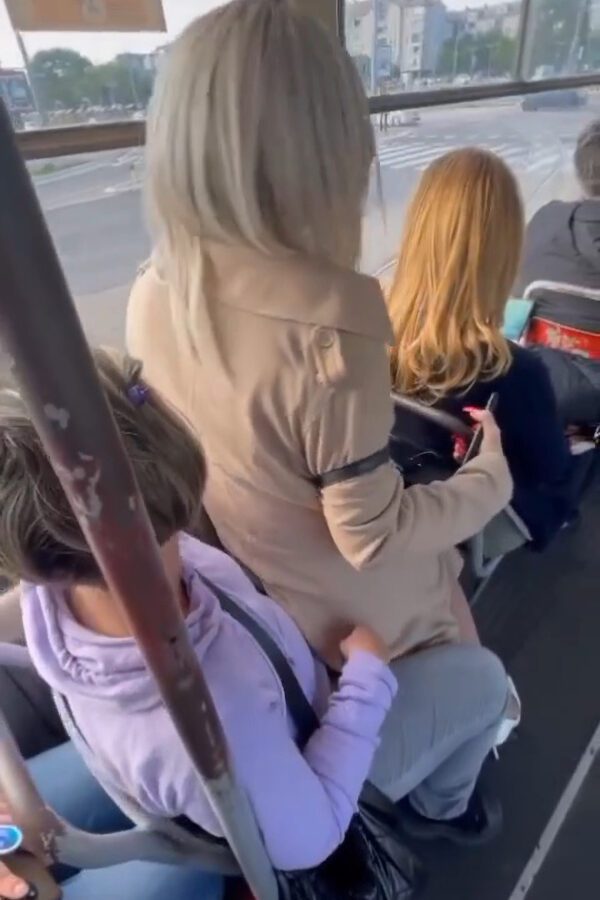 Glamorous Blonde Sits On Older Woman’s Lap On Busy Tram Because She Had Sore Feet